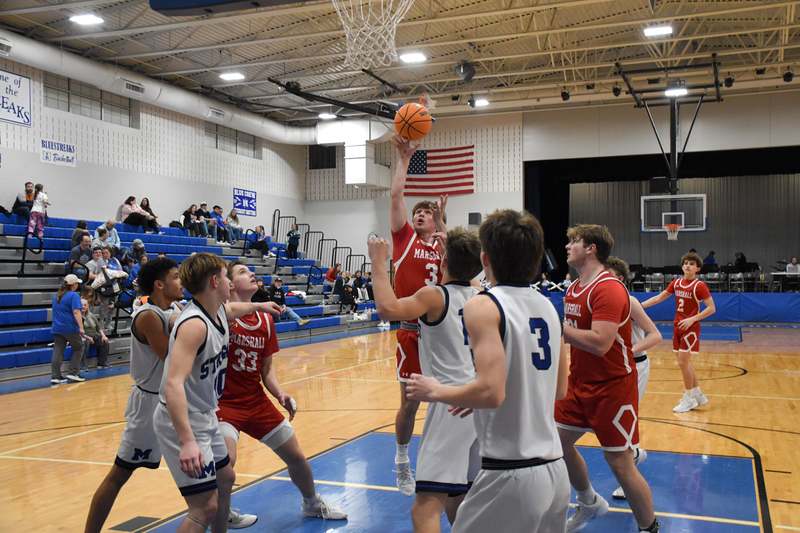 Liam Keim (3) drops in a shot inside the lane for Marshall against Martinsville