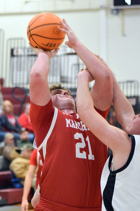 Garret Pugh scores inside with an Olney defender draped all over him