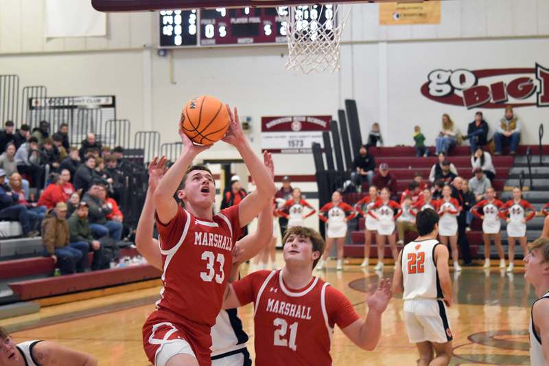 Bryce Griguhn goes up and scores for Marshall against Olney in the LIC Tournament