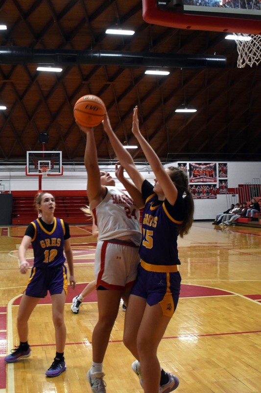 Ella Mattas (24) goes inside and scores against the Lady Buffaloes of Georgetown-Ridge Farm