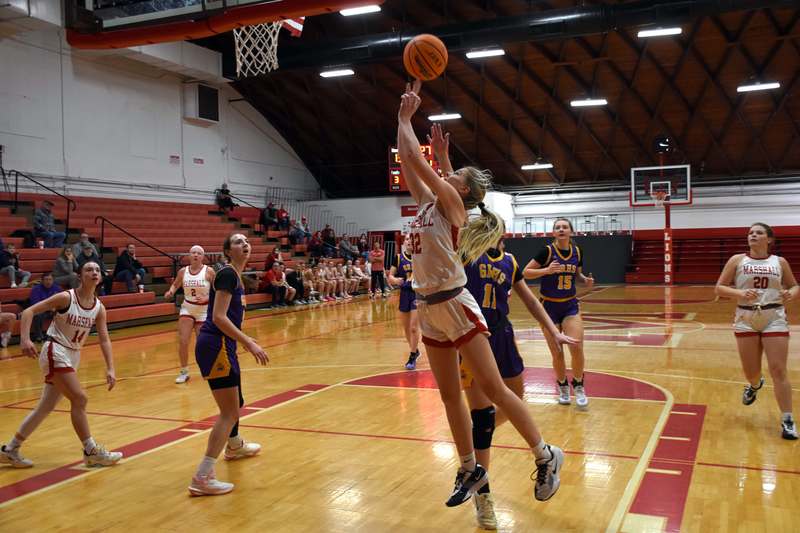 Harper Richardson (32) makes an acrobatic shot in the win over Georgetown-Ridge Farm