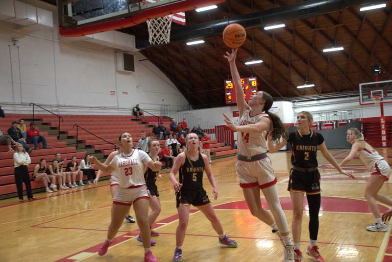 Marlee Heighton (14) drops in a floater for Marshall vs ALAH