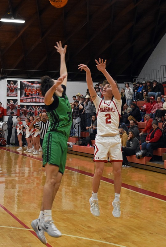 Tucker Osborn (2) hit four threes in leading Marshall with 16 points against West Vigo