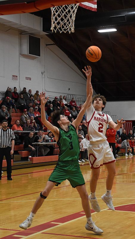 Tucker Osborn (2) goes up inside and ties the game early against West Vigo