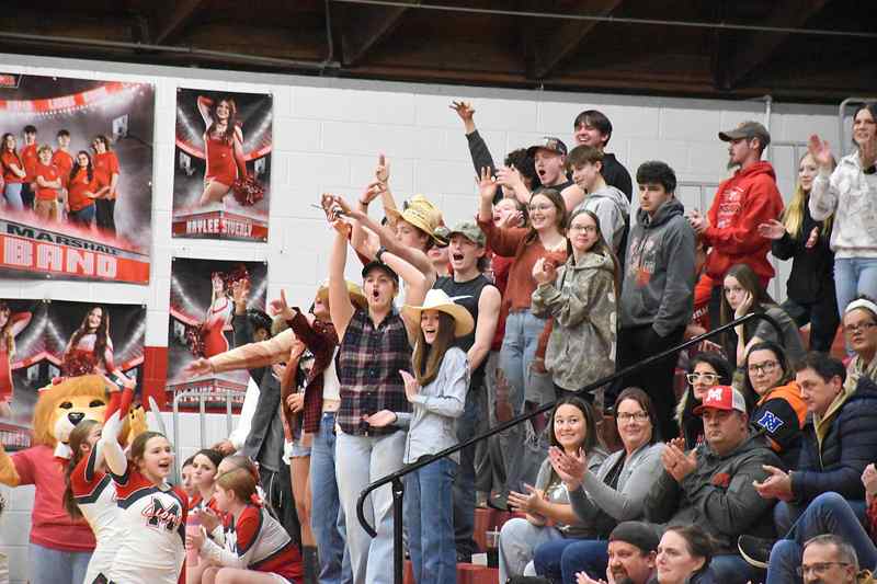 Marshall's student section roars after Tucker Osborn ties the game with a big triple in the second quarter against West Vigo 