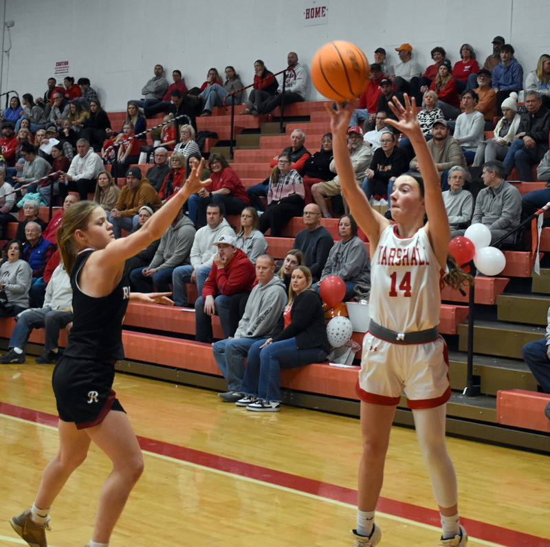 Marlee Heighton drains a big three-pointer to push the Lions to a halftime lead