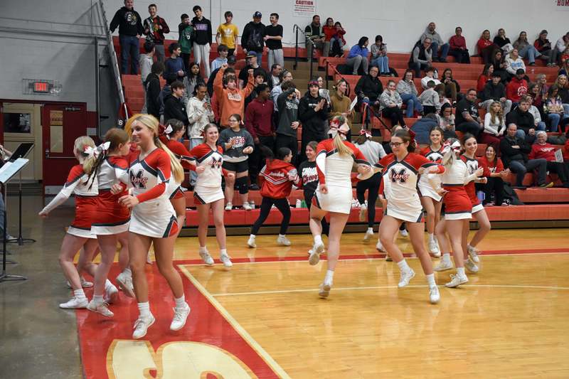 Marshall High Cheerleaders dance to the pep band's rendition of The Chicken Dance