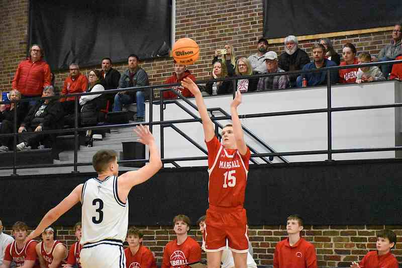 Tommy Sheehy (15) drains a three-pointer for Marshall at the buzer to end the third quarter against La Salette Academy (1)