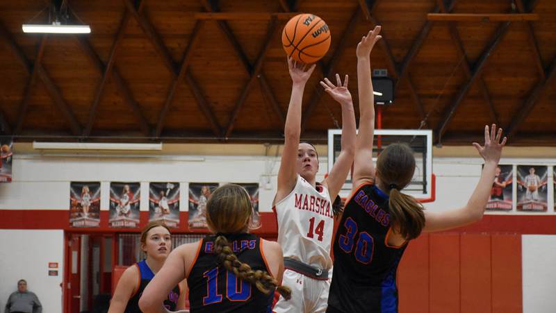 Senior Marlee Heighton (14) reached the 1,000 point plateau in her final regular season game with 17 points against Newton (1)