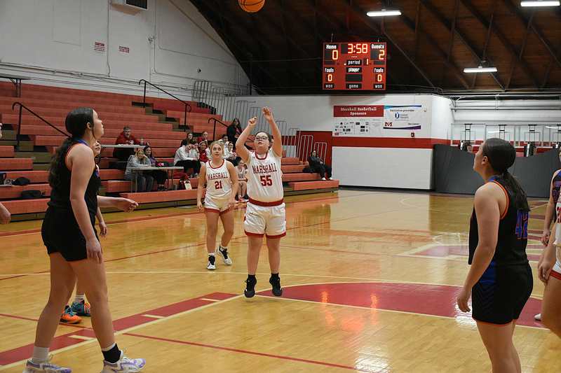 Marshall starter Jayden Jones drains a 15-footer to score the Lions' first two points in the final JV game of the season