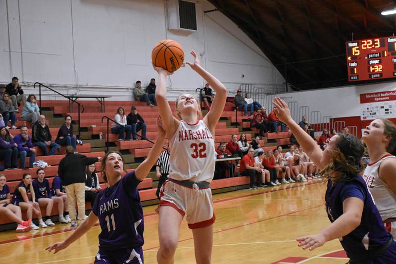 Harper Richardson (32) scores 2 of her 13 points against Shelbyville in the state tournament
