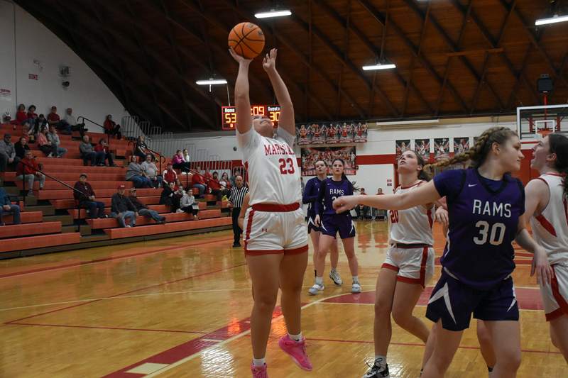 Caitlyn Hilliard (23) goes up and scores for Marshall against Shelbyville in the state tournament