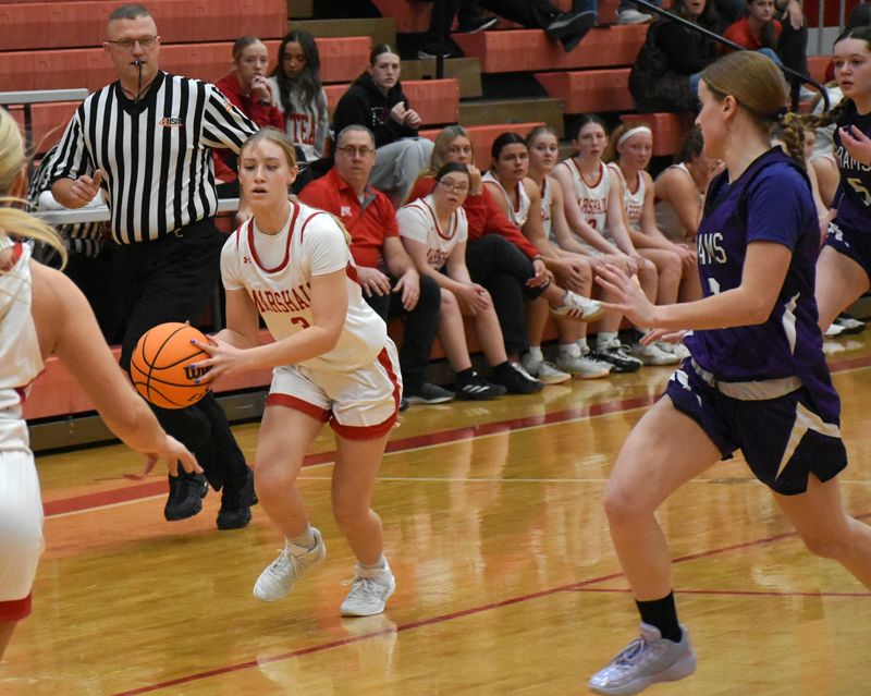 Caitlyn Hilliard (23) goes up and scores for Marshall against Shelbyville in the state tournament