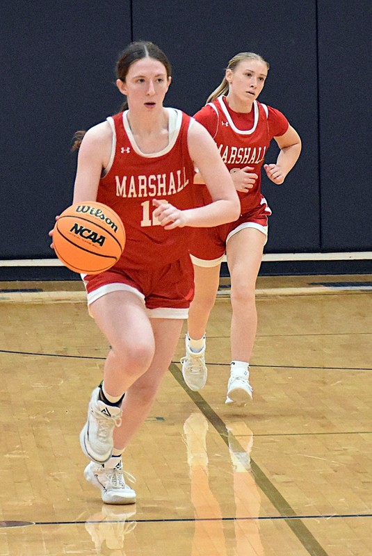 Addy Ross (12) brings the ball up the floor during the regional semifinal