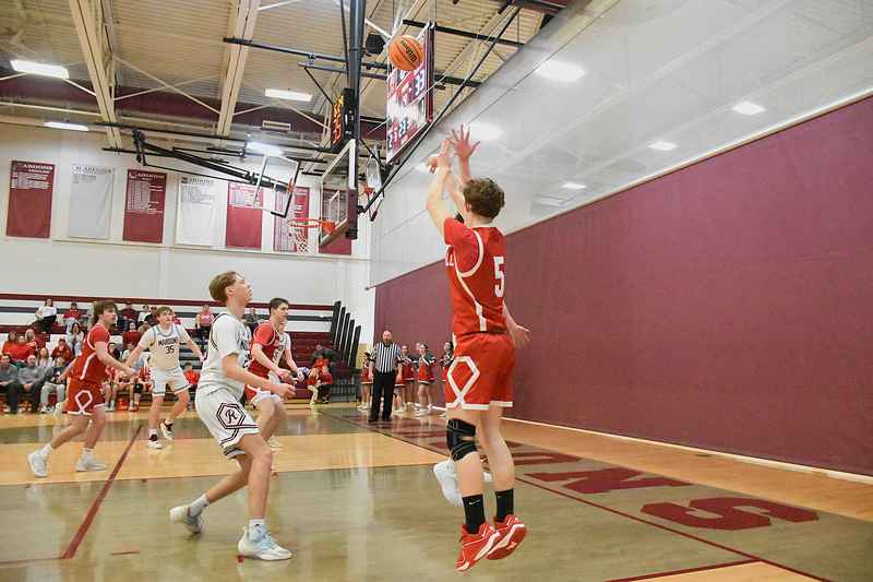 Brady Landrus (5) hit a pivotal three-pointer to tie the game in the third quarter against Robinson