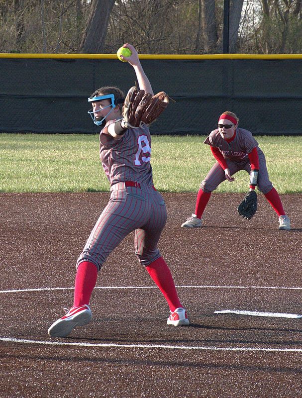 Mollie Kent (19) fires the final pitch as shortstop Lynn Welborn readies for a grounder which ended the game against Georgetown-Ridge Farm