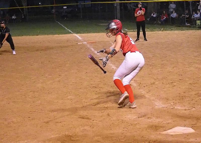Lauren English bunts safely for a single against Robinson