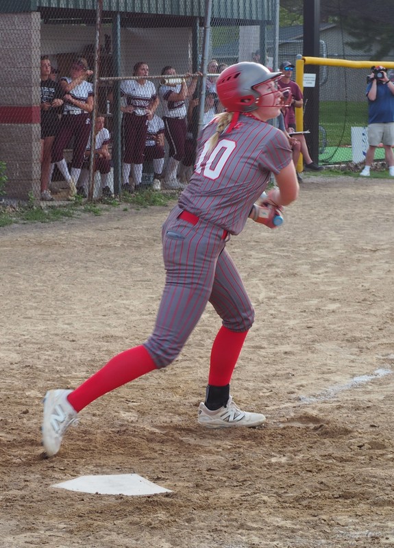 Kyla Gustafson watches her smash that went all the way to the fence in right field against Robinson