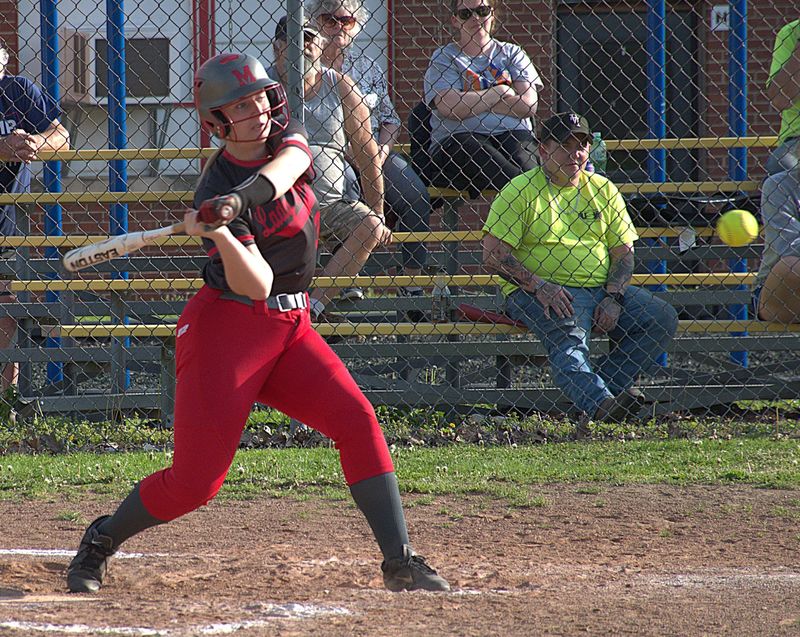 Katelyn McNeely smacks a single to left to bring home two runs for Marshall