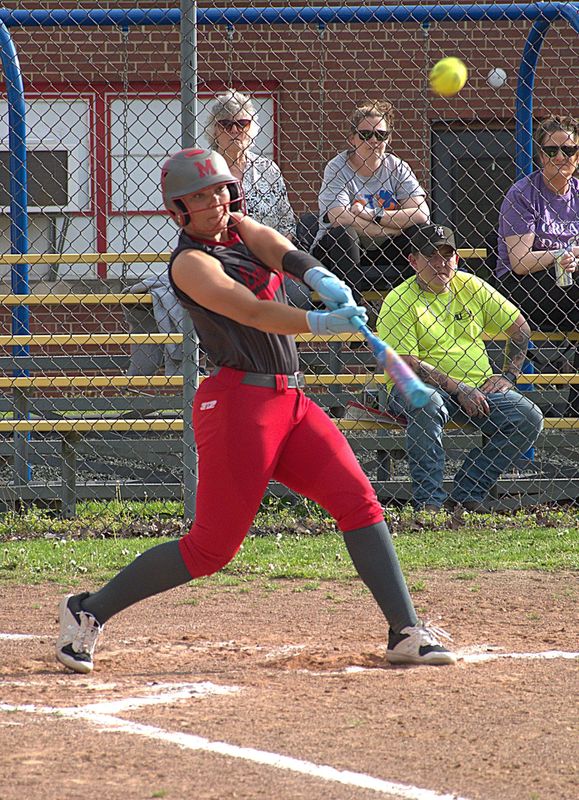 Caitlyn Hilliard launches a 2-run homer against Tri-County during Marshall's 21-1 win