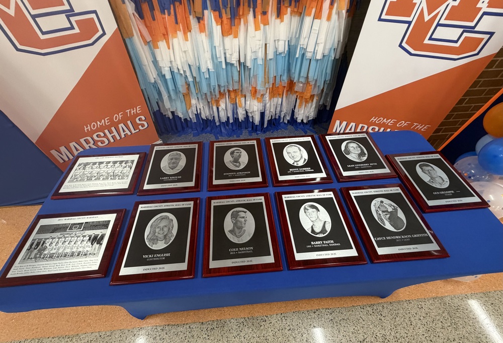 Photo with each atheltic hall of fame plaque