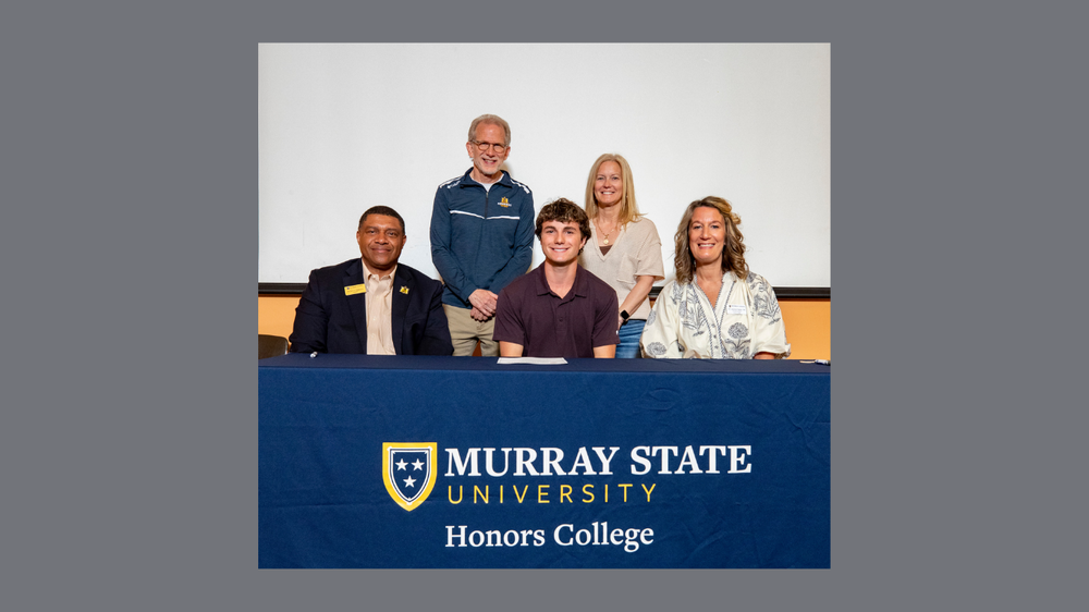 Picture of Cade Sorrels with MSU reps. 