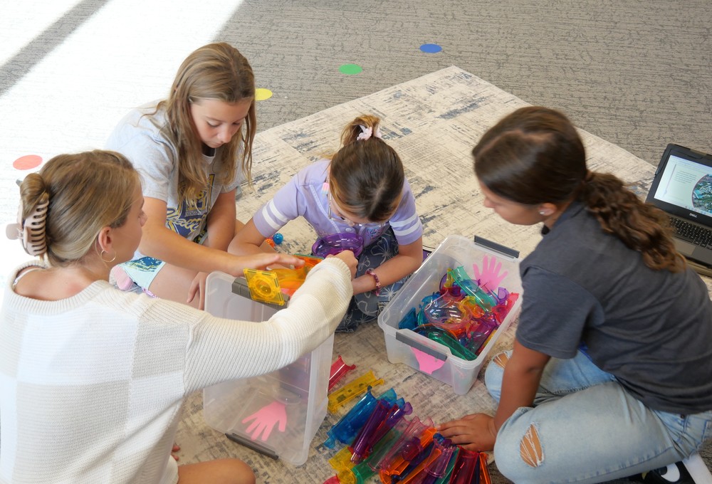 SES student working with Picasso Tiles