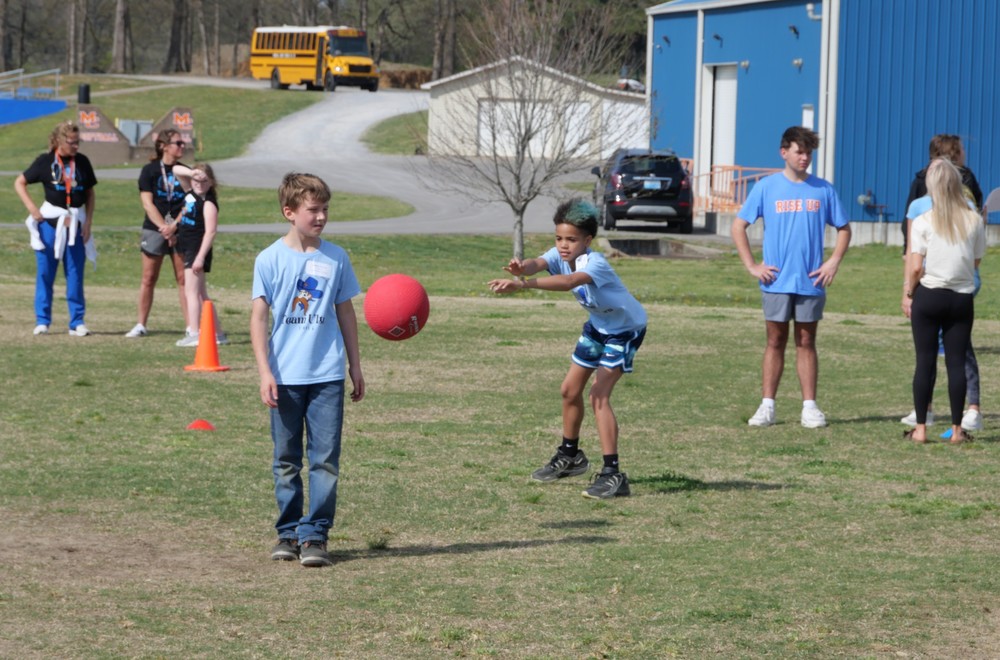 Students playing dodge ball at Team Ultra Field Day