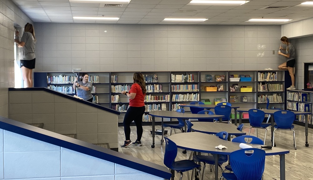 CFSB staff paint JES library