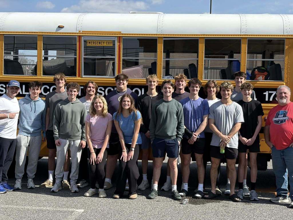 Piture of Track Team in front of bus enroute to State Indoor Championship