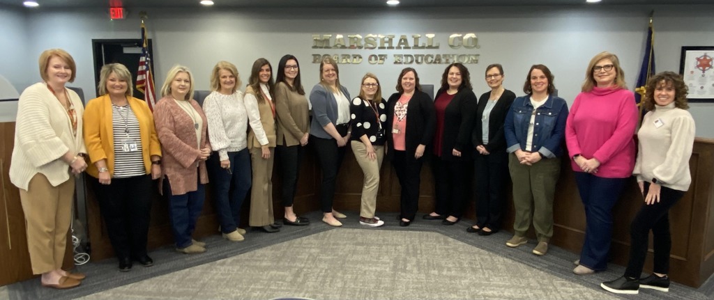 school board members gathered in the office
