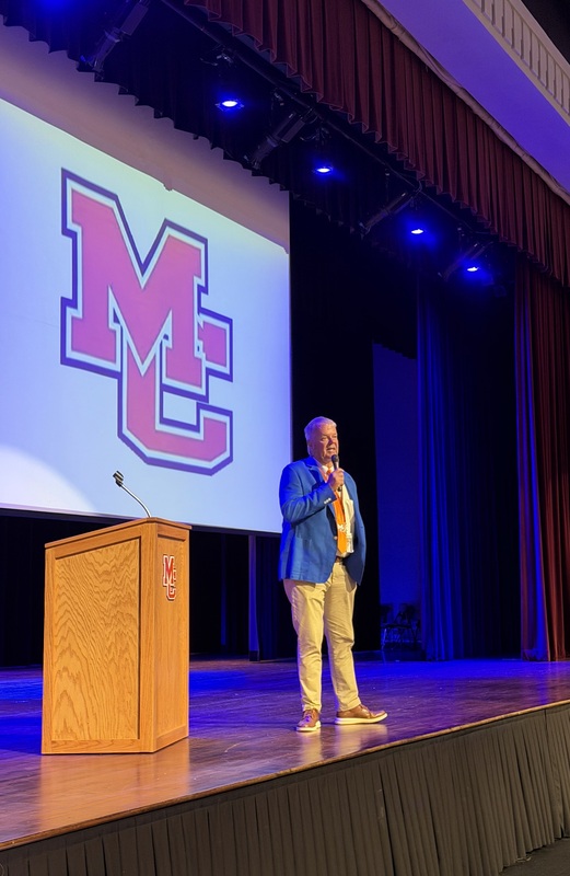 Supt. Bill Thorpe on PAC stage speaking to staff