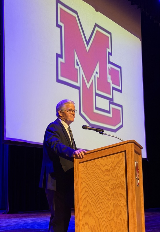 Guest speaker Dist. Judge Jack Telle on PAC stage addressing staff