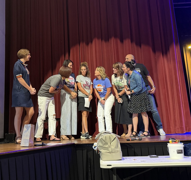 School principals huddle on PAC stage