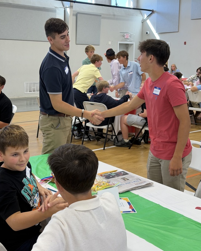 Students practicing the proper handshake