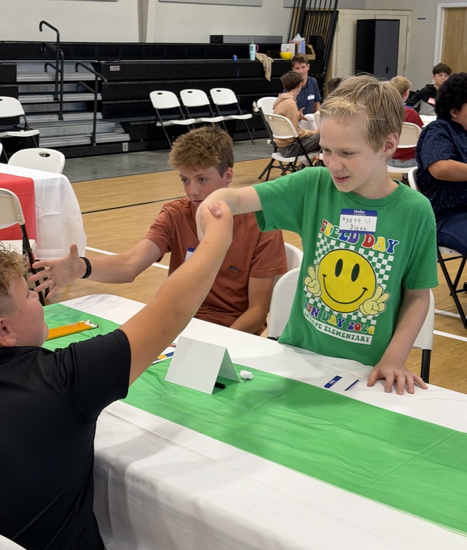 Students practicing the proper handshake