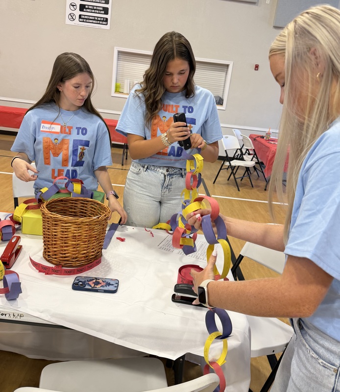 MCHS female students piecing together the Leadership Characteristics Chain
