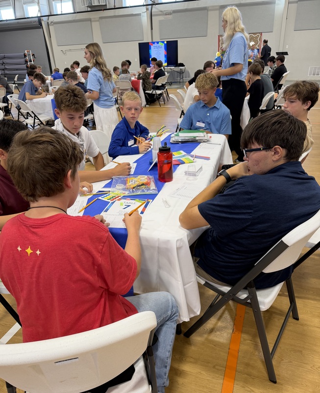 Particpants at Marshall Male Leadership Conference sitting at table