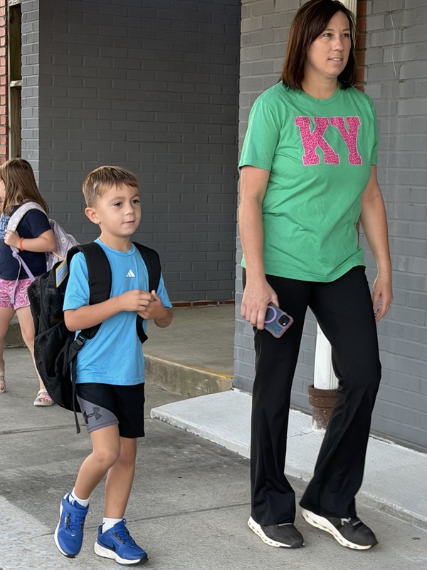 Mother and son walking to school on International Walk to School Day