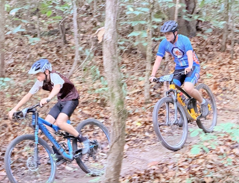 Mc Mountain bikers racing on trail