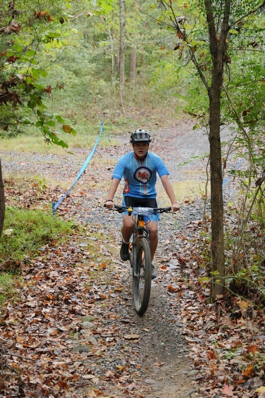 Mc Mountain bikers racing on trail