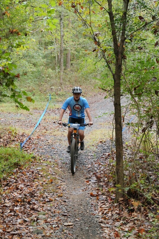 Mc Mountain bikers racing on trail
