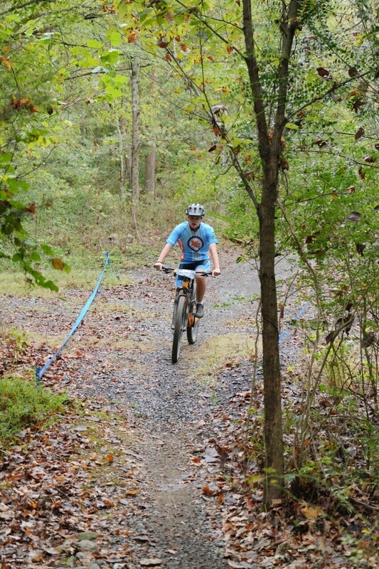 Mc Mountain bikers racing on trail