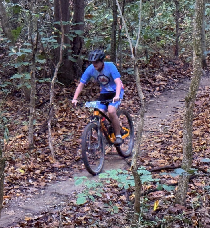 Mc Mountain bikers racing on trail