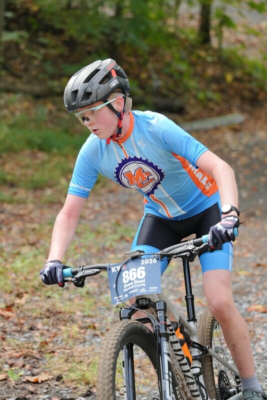 Mc Mountain bikers racing on trail