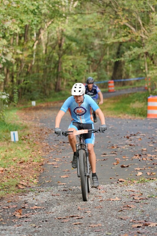 Mc Mountain bikers racing on trail