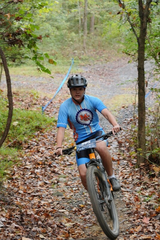 Mc Mountain bikers racing on trail