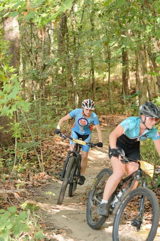 Mc Mountain bikers racing on trail