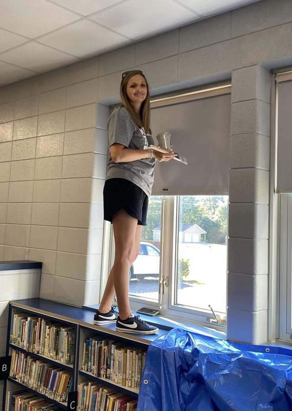 CFSB staff paint JES library