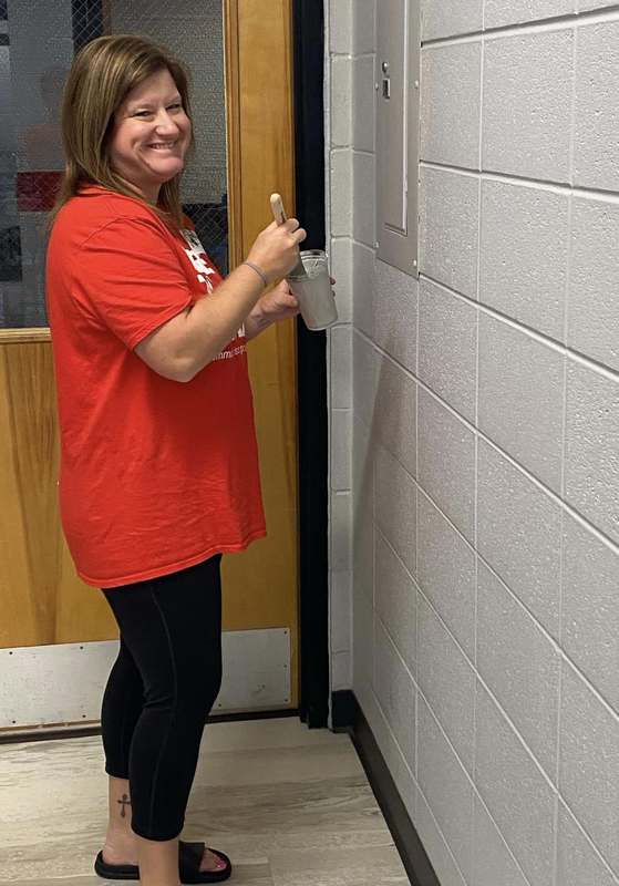 CFSB staff paint JES library